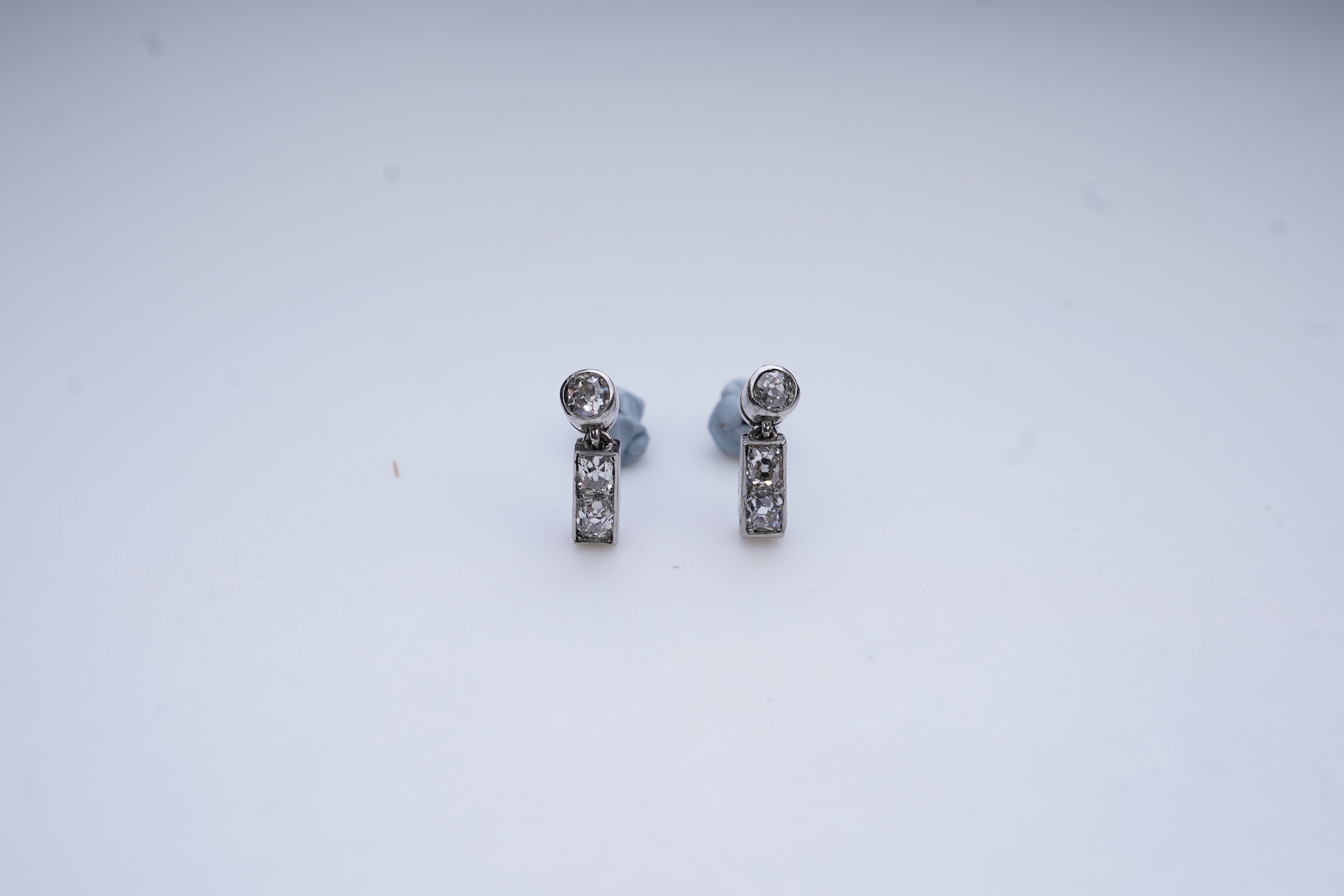 A pair of diamond earrings, early 20th century composite